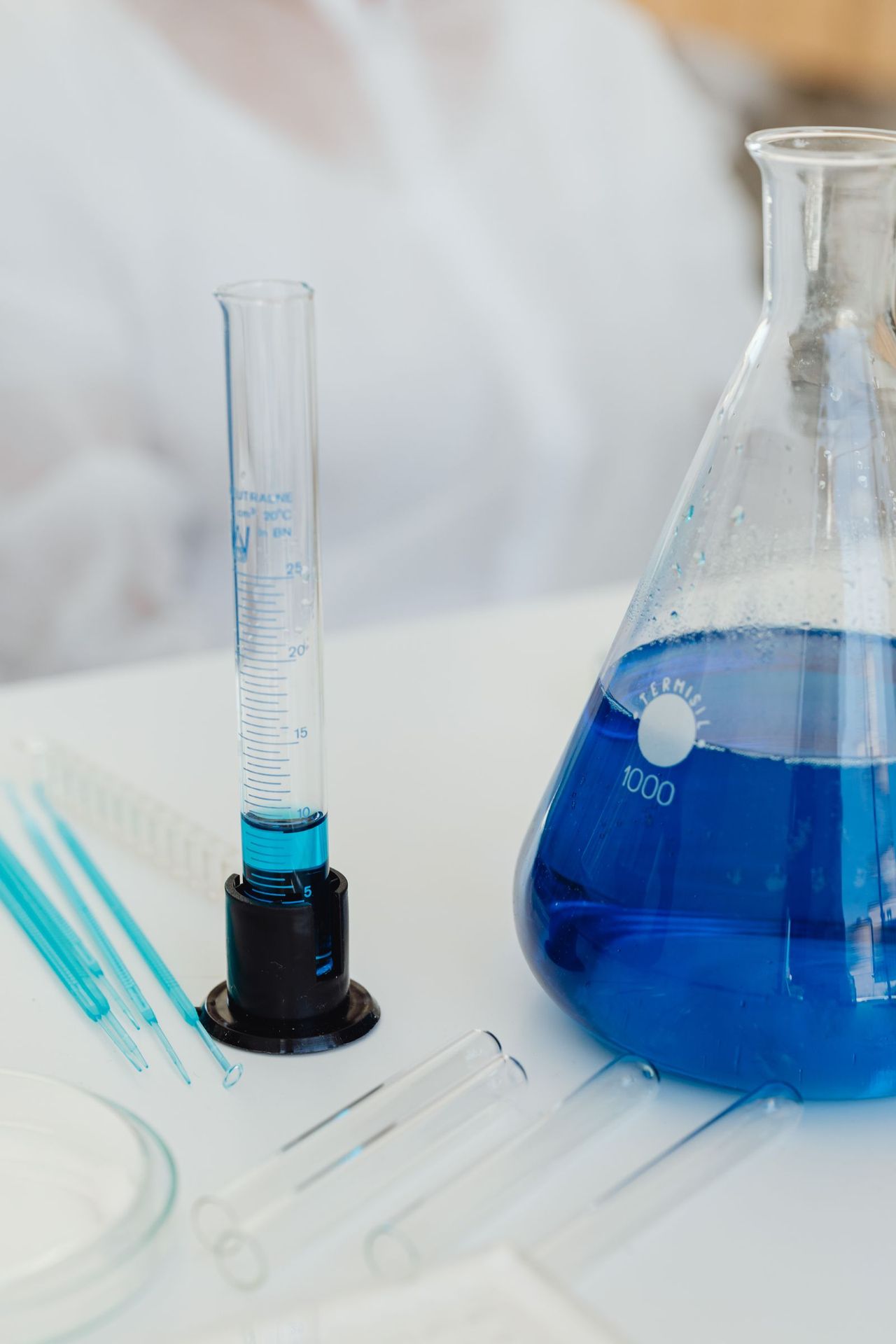 Blue laboratory glassware on a research bench